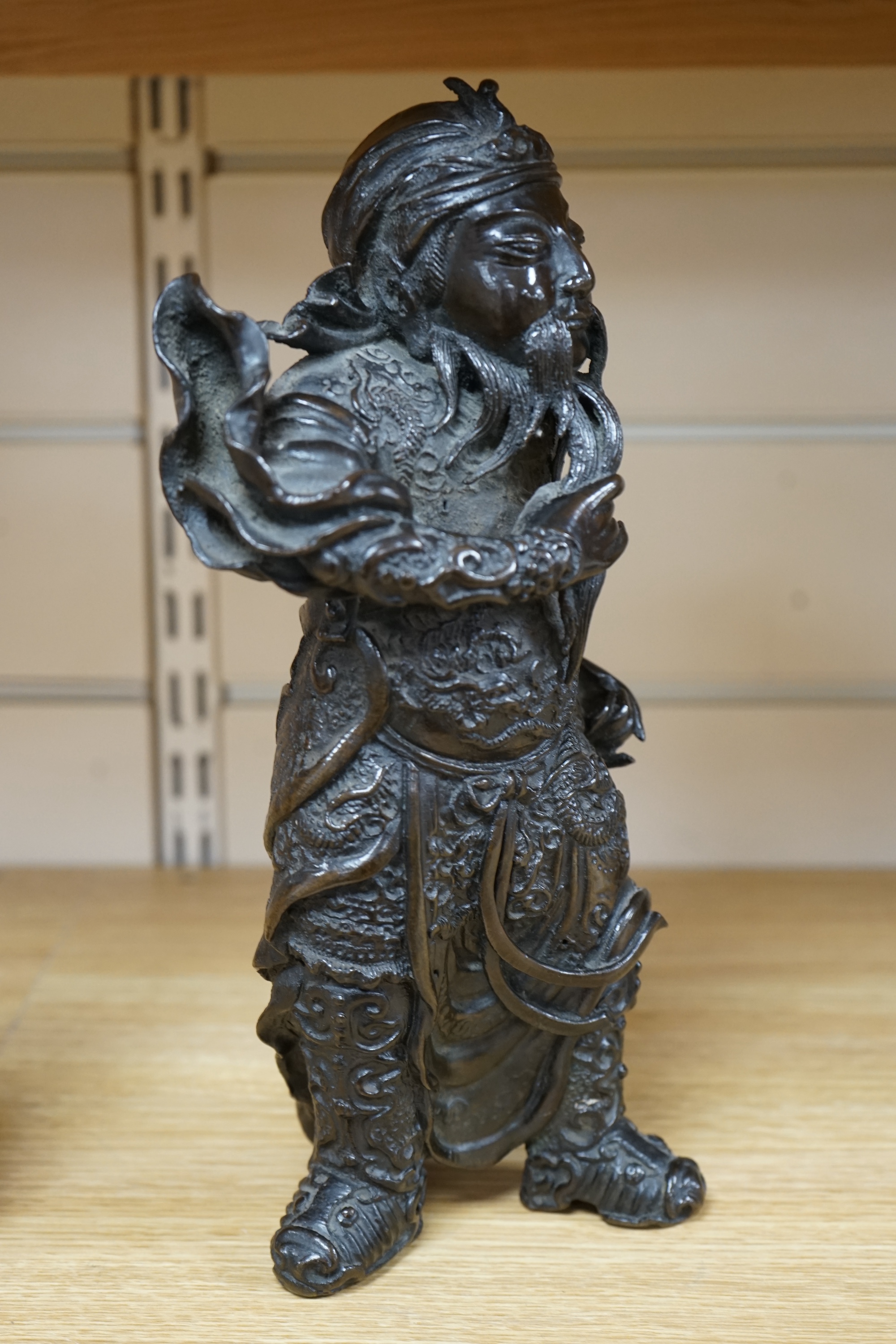 A 20th century Chinese bronze figure of Guan Yu, 29cm. Condition - fair to good